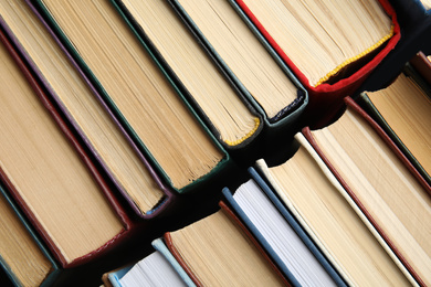 Many different hardcover books as background, top view