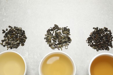 Photo of Flat lay composition with green tea on grey table