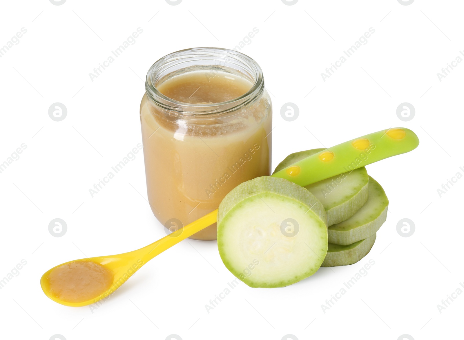 Photo of Tasty baby food in jar, spoon and fresh squash isolated on white