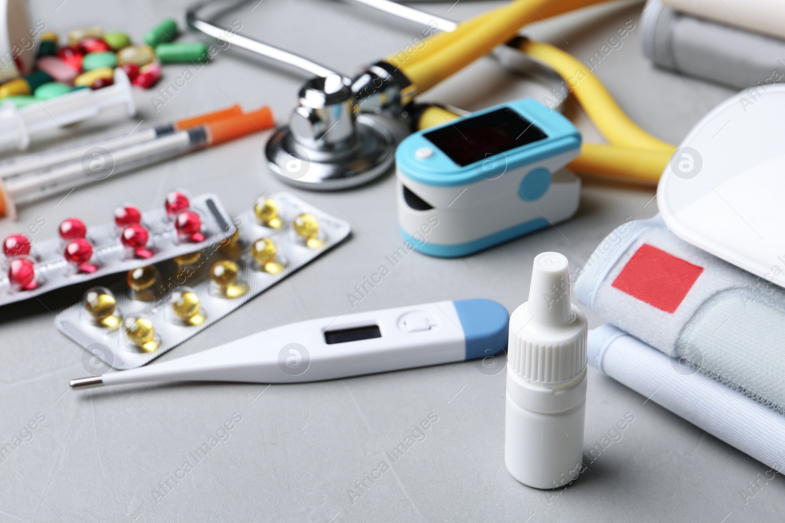Photo of Set of medical objects on grey table