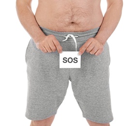 Photo of Mature man with urological problems holding SOS sign on white background