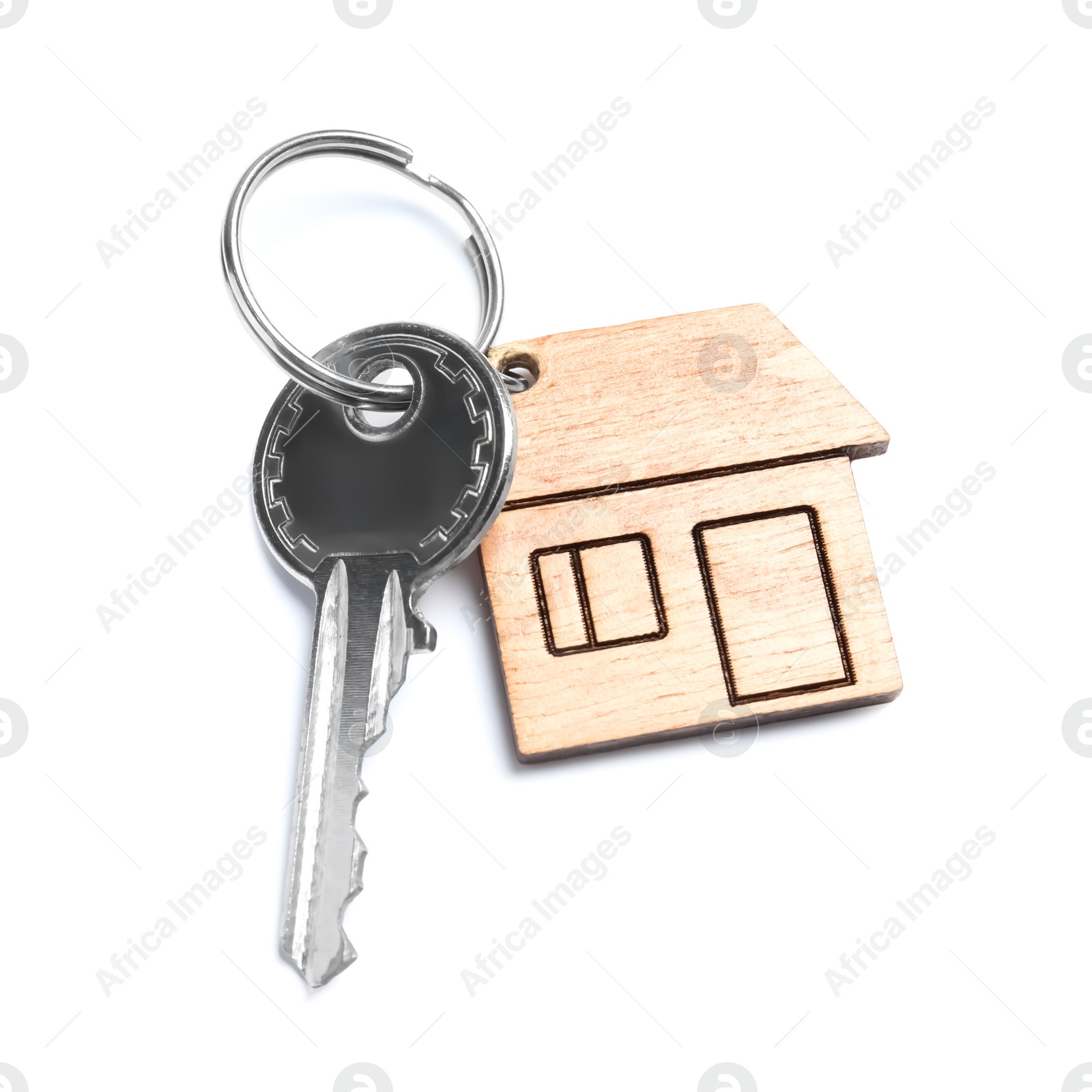 Photo of House key with trinket on white background