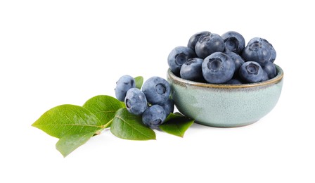 Photo of Fresh ripe blueberries and leaves isolated on white