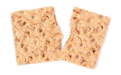 Fresh broken crispbread on white background, top view