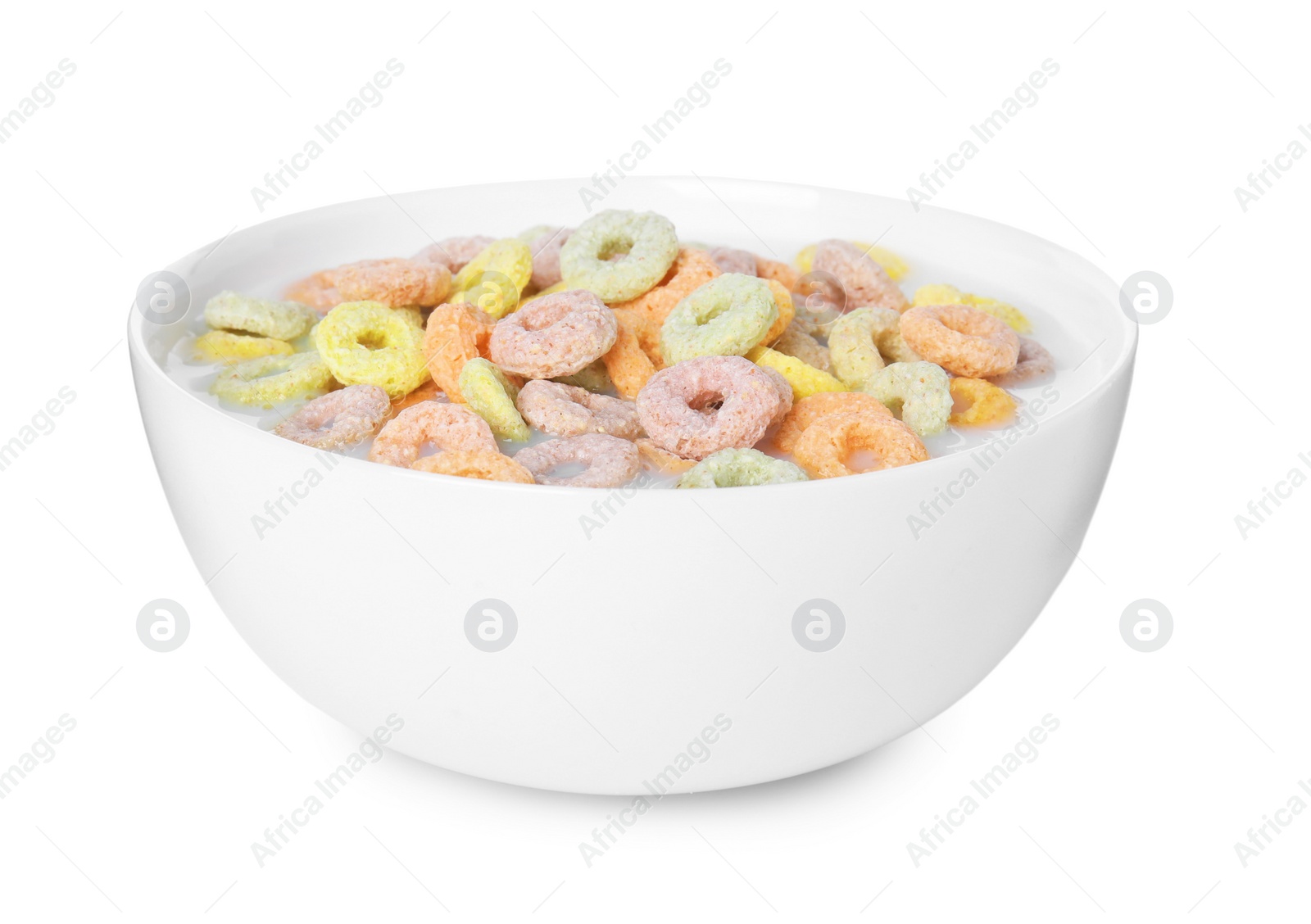 Photo of Tasty colorful cereal rings and milk in bowl isolated on white