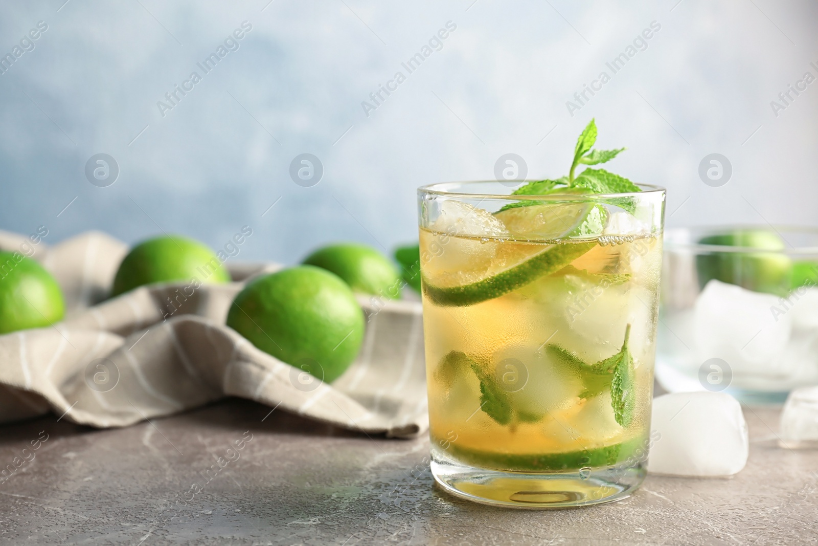 Photo of Composition with delicious mint julep cocktail on table