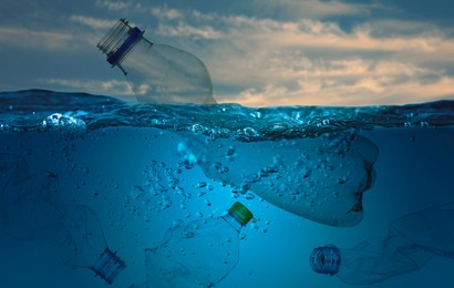 Image of Many plastic bottles in ocean. Environmental pollution