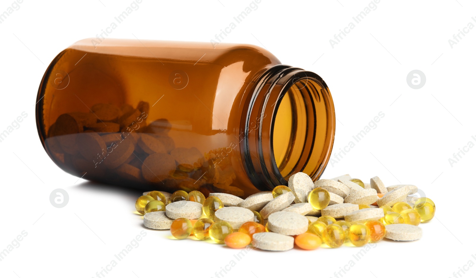 Photo of Bottle with different vitamin pills isolated on white