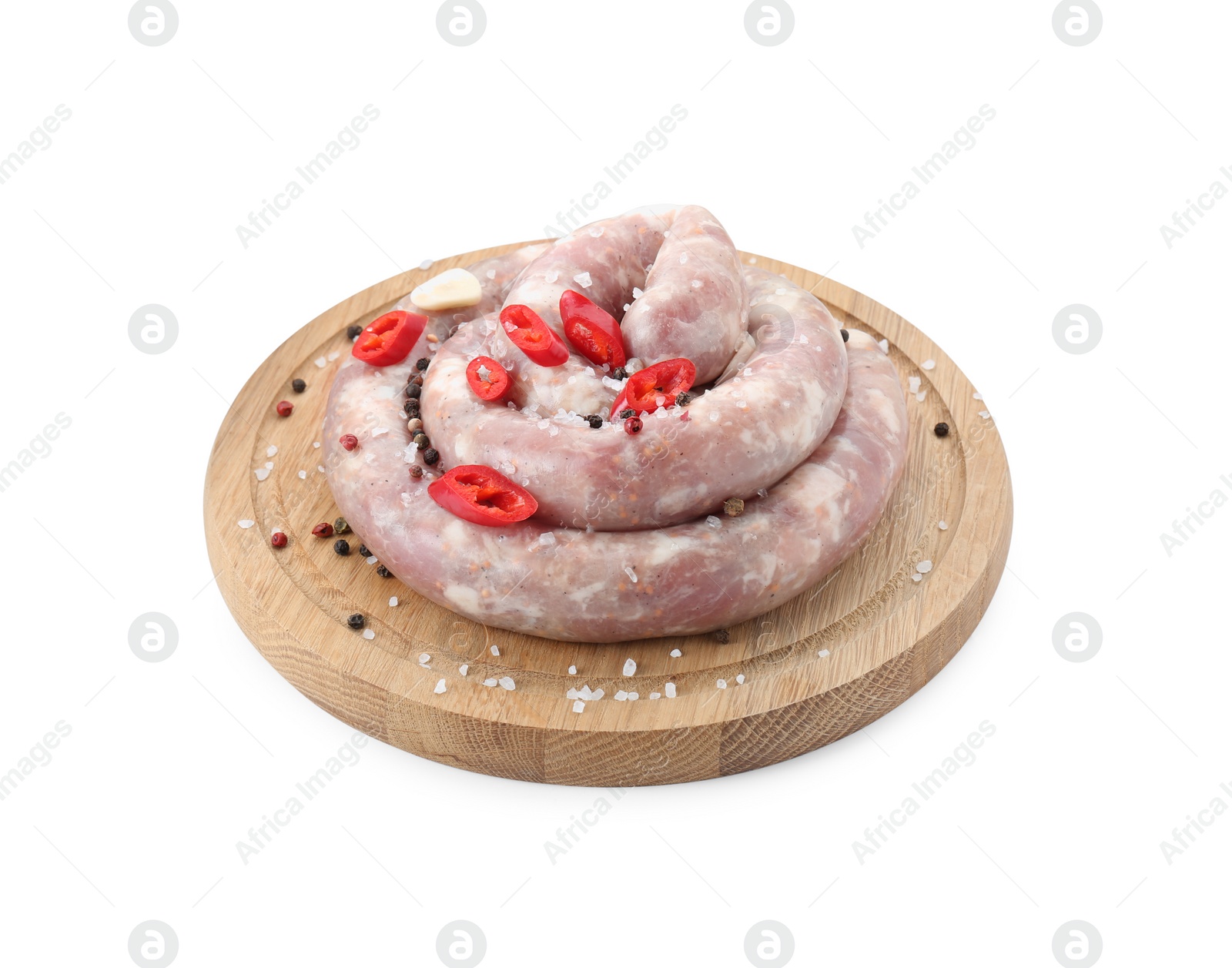 Photo of Board with homemade sausage, chili and spices isolated on white