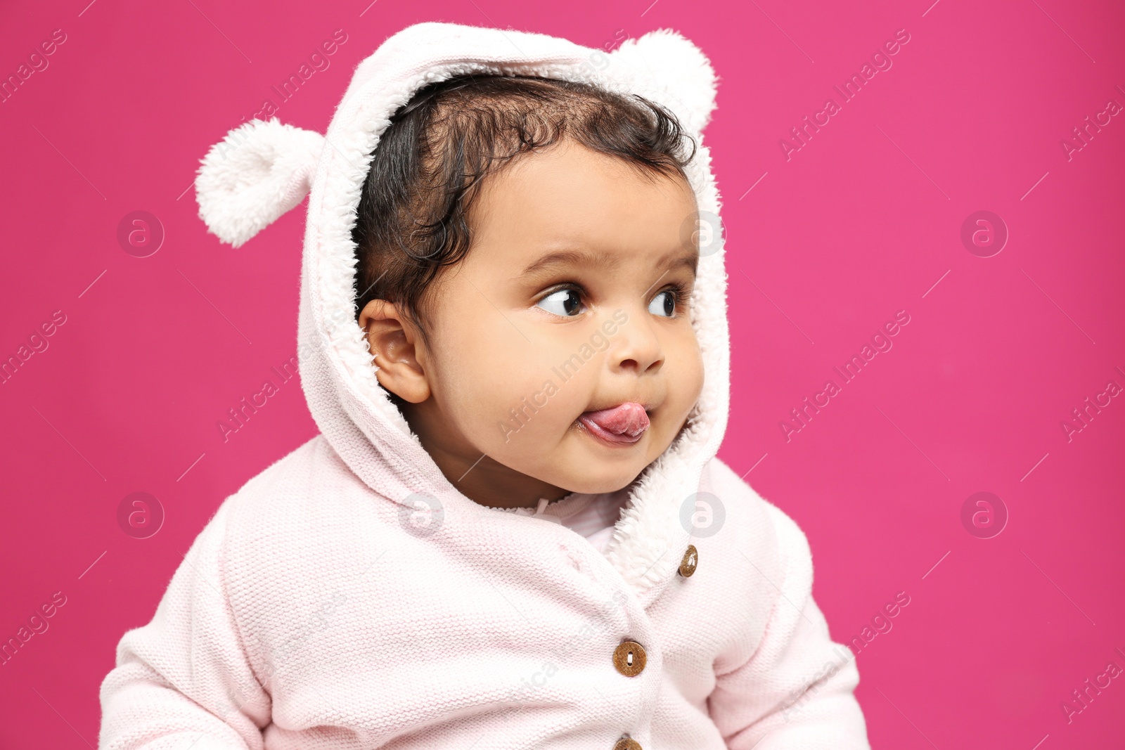 Photo of Cute African American baby on pink background