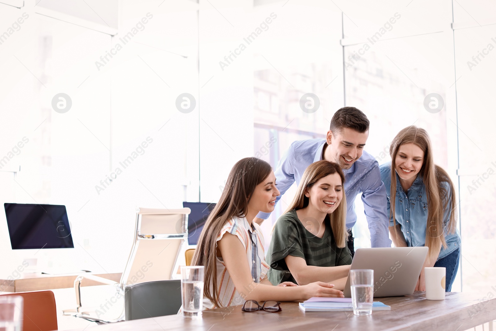 Photo of Young people having business training in office