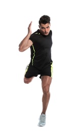 Photo of Sporty young man running on white background