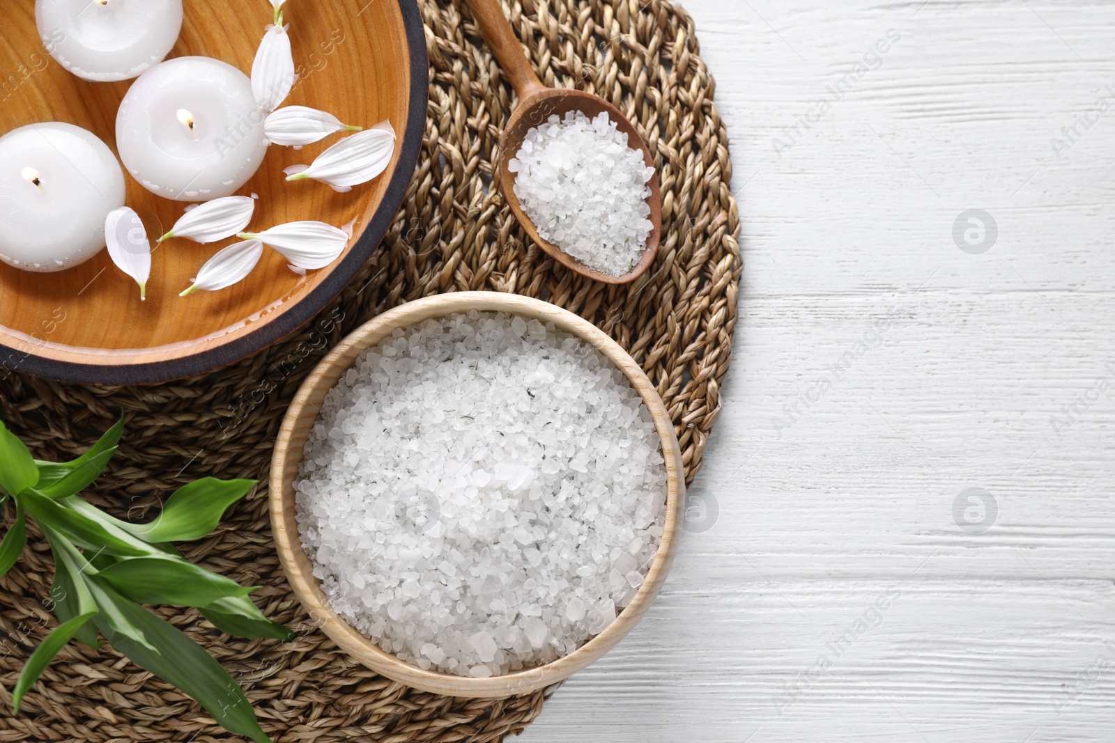 Photo of Flat lay composition with sea salt on white wooden background, space for text. Spa treatment