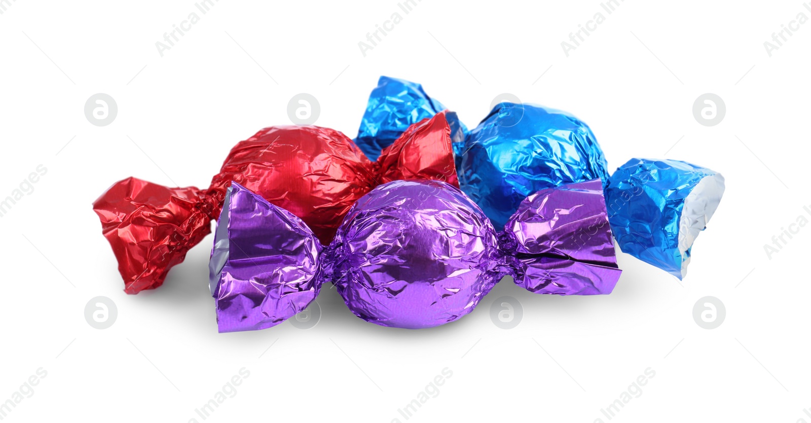 Photo of Tasty candies in colorful wrappers isolated on white