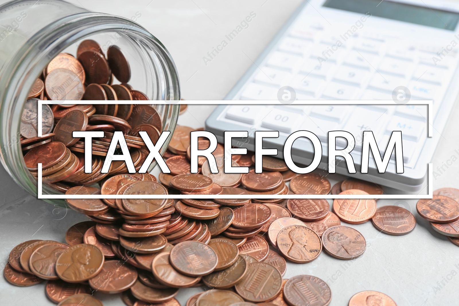 Image of Overturned glass jar with coins and calculator on table, closeup. Tax reform