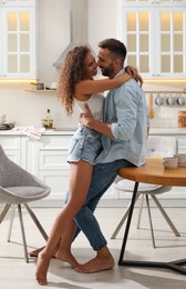 Photo of Lovely couple enjoying time together in kitchen