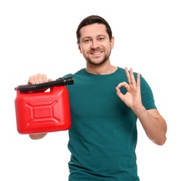 Man holding red canister and showing OK gesture on white background