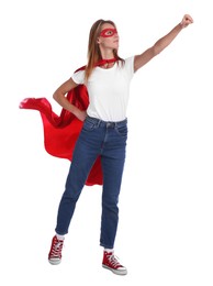 Photo of Confident woman wearing superhero cape and mask on white background