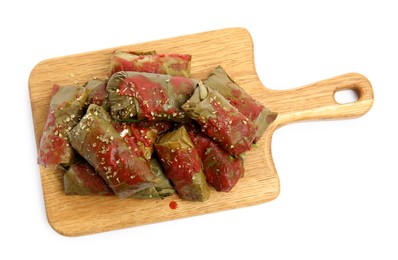 Delicious stuffed grape leaves with tomato sauce on white background, top view