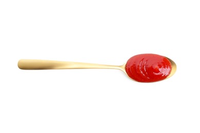 Spoon with tasty ketchup isolated on white, top view. Tomato sauce