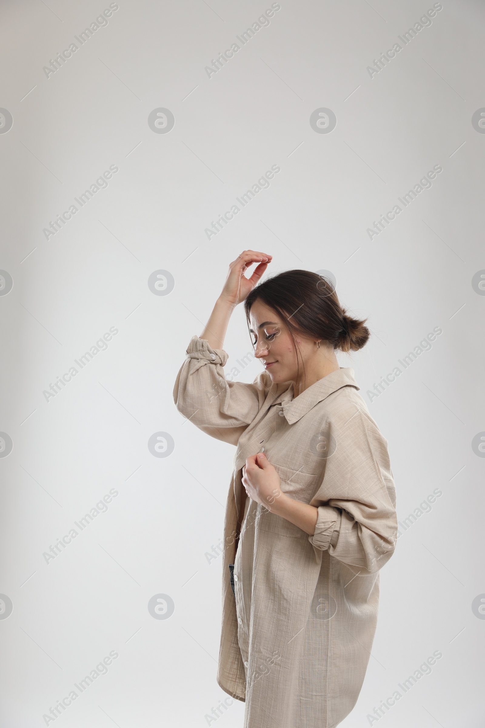 Photo of Portrait of beautiful woman on light grey background