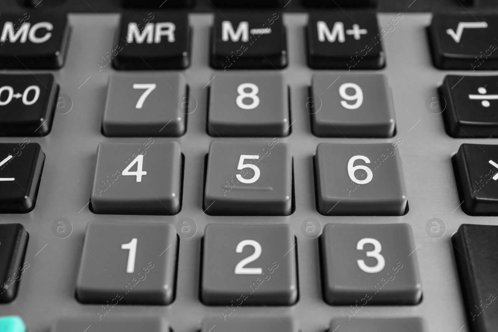 Photo of Closeup view of modern calculator as background