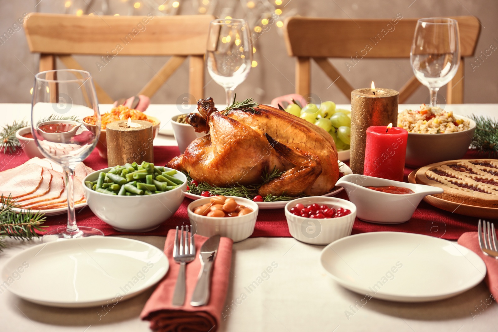 Photo of Traditional festive dinner with delicious roasted turkey served on table