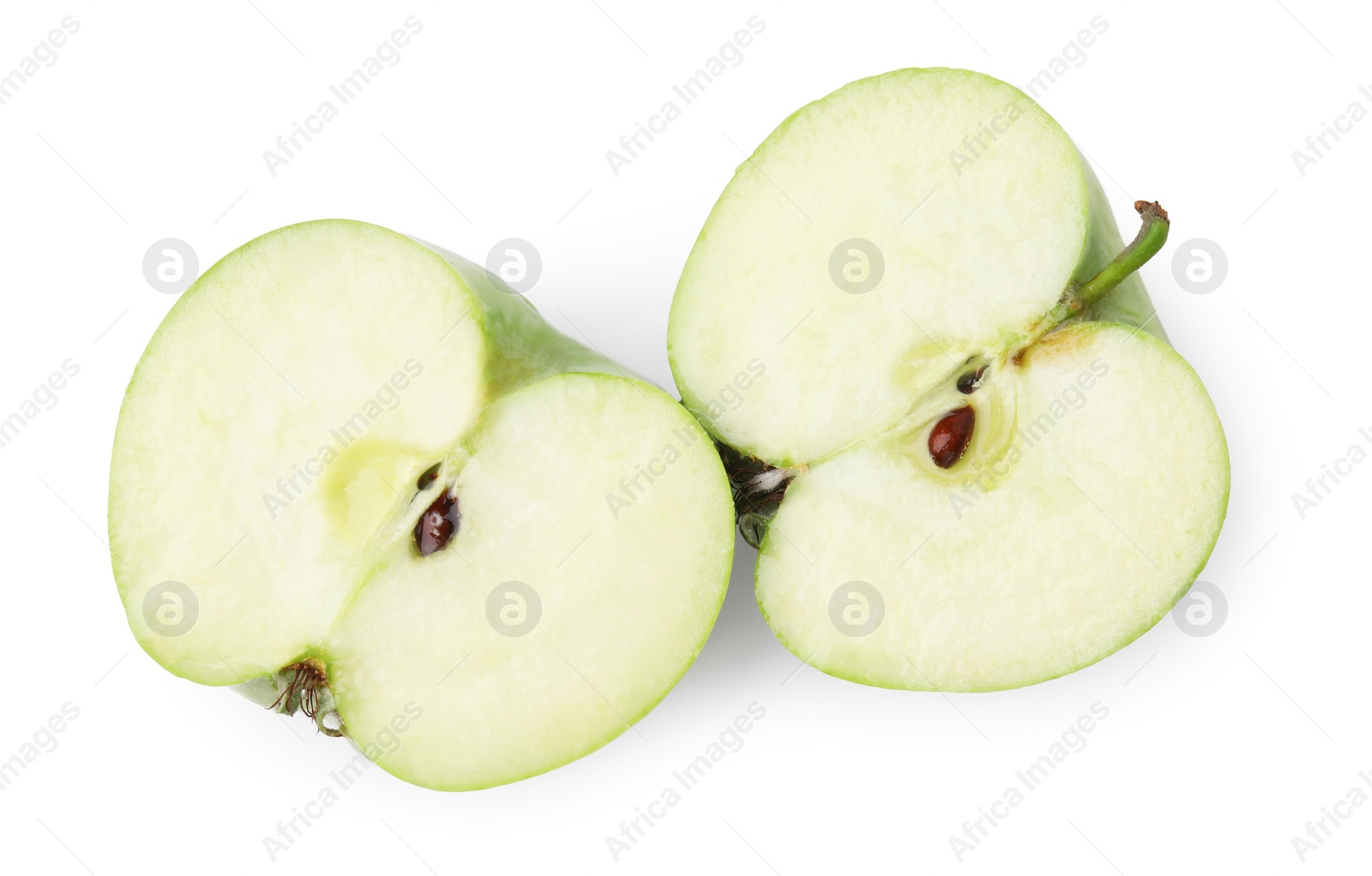 Photo of Halves of ripe green apple on white background, top view