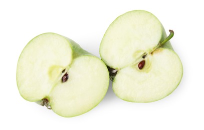 Halves of ripe green apple on white background, top view