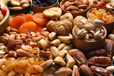 Photo of Composition of different dried fruits and nuts, closeup
