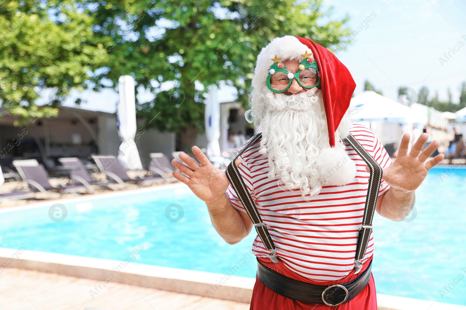 Photo of Authentic Santa Claus with funny glasses at resort