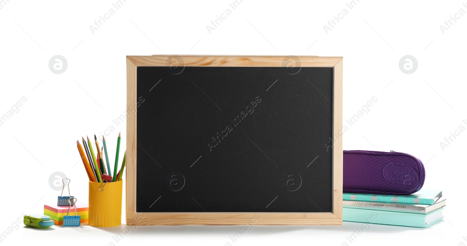 Photo of Small chalkboard and different school stationery on white background