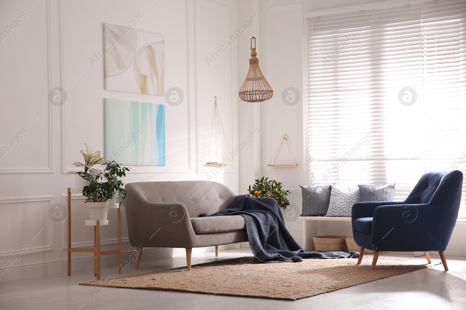 Photo of Beautiful living room interior with comfortable gray sofa