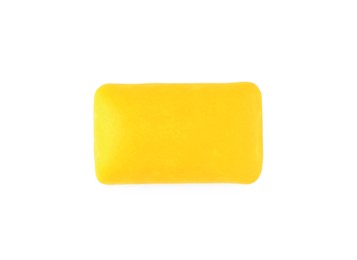 Photo of One tasty yellow chewing gum isolated on white, top view