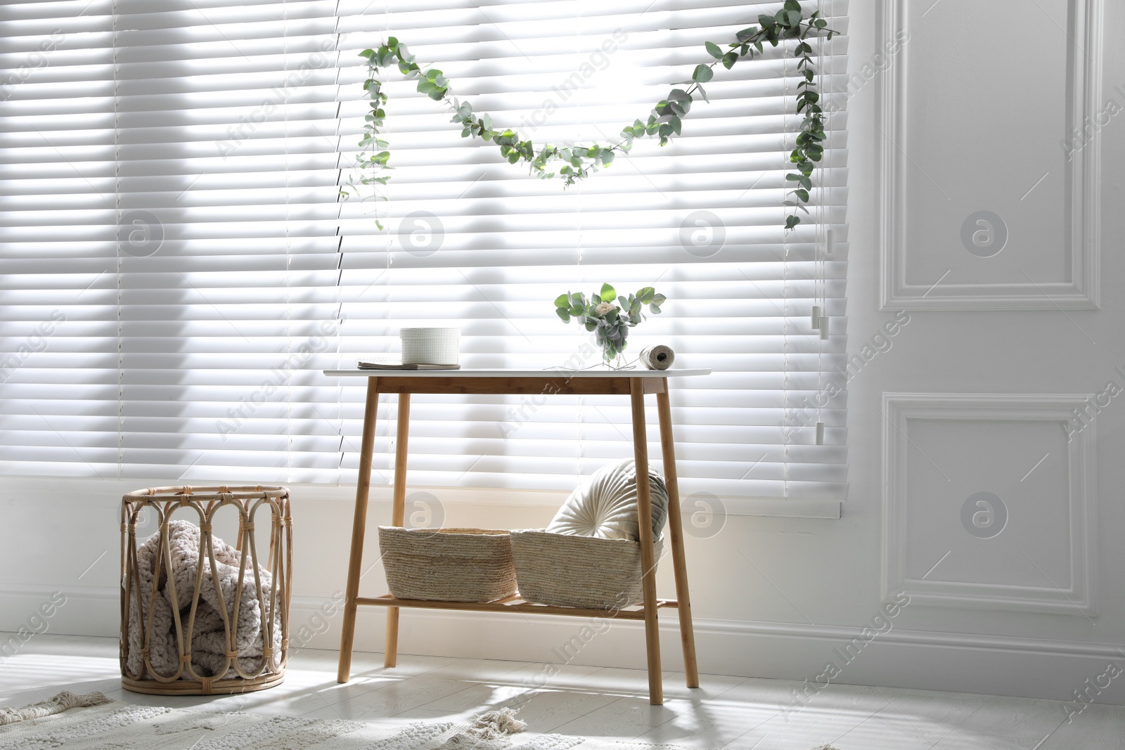 Photo of Stylish room decorated with beautiful eucalyptus garland