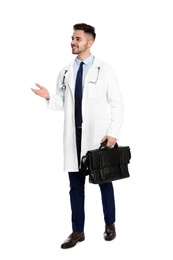 Photo of Full length portrait of medical doctor with bag isolated on white