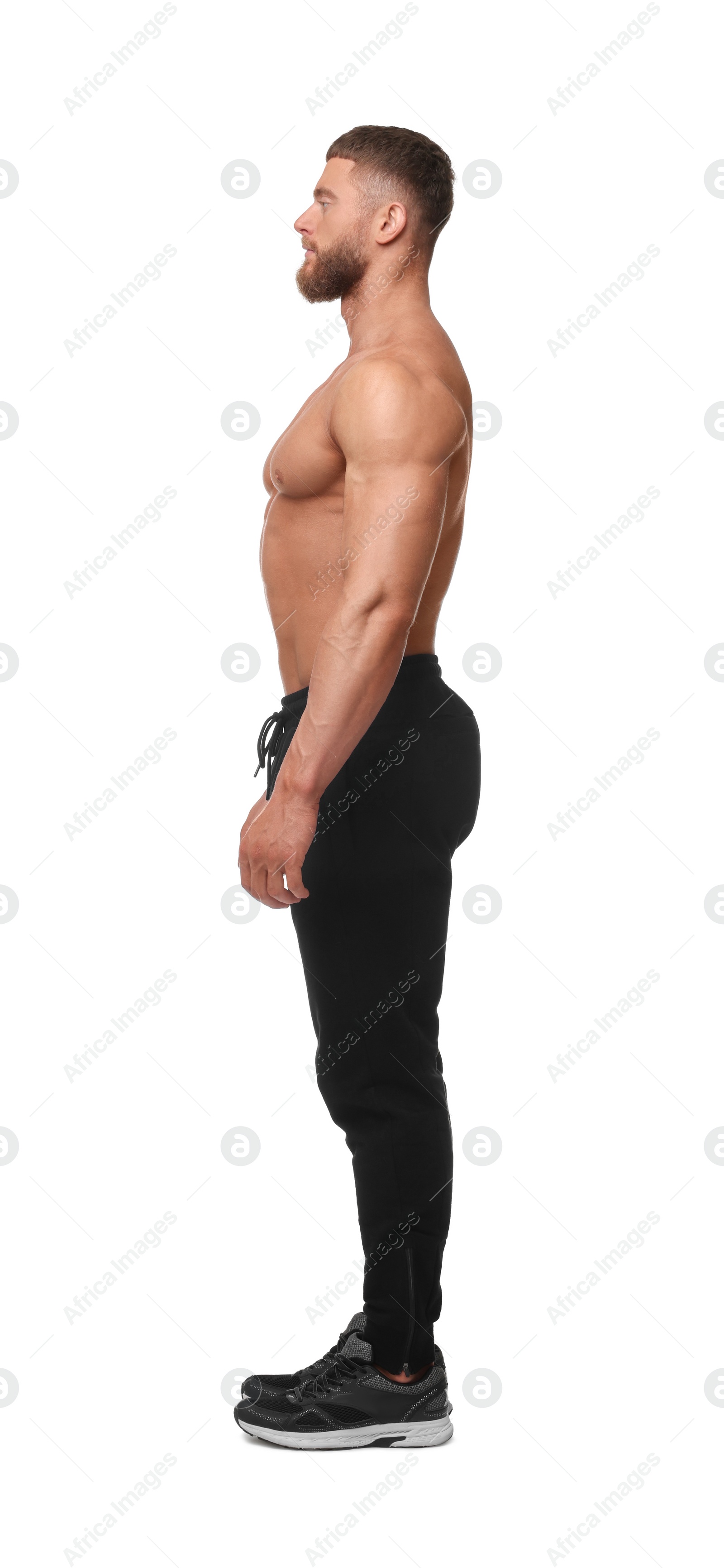 Photo of Young bodybuilder with muscular body on white background