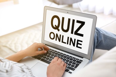 Image of Woman using modern laptop for taking quiz online at home, closeup