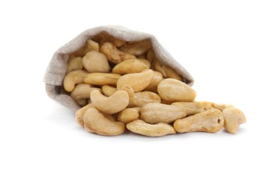 Photo of Sack and tasty organic cashew nuts isolated on white