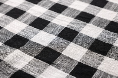 Black checkered tablecloth as background, closeup view