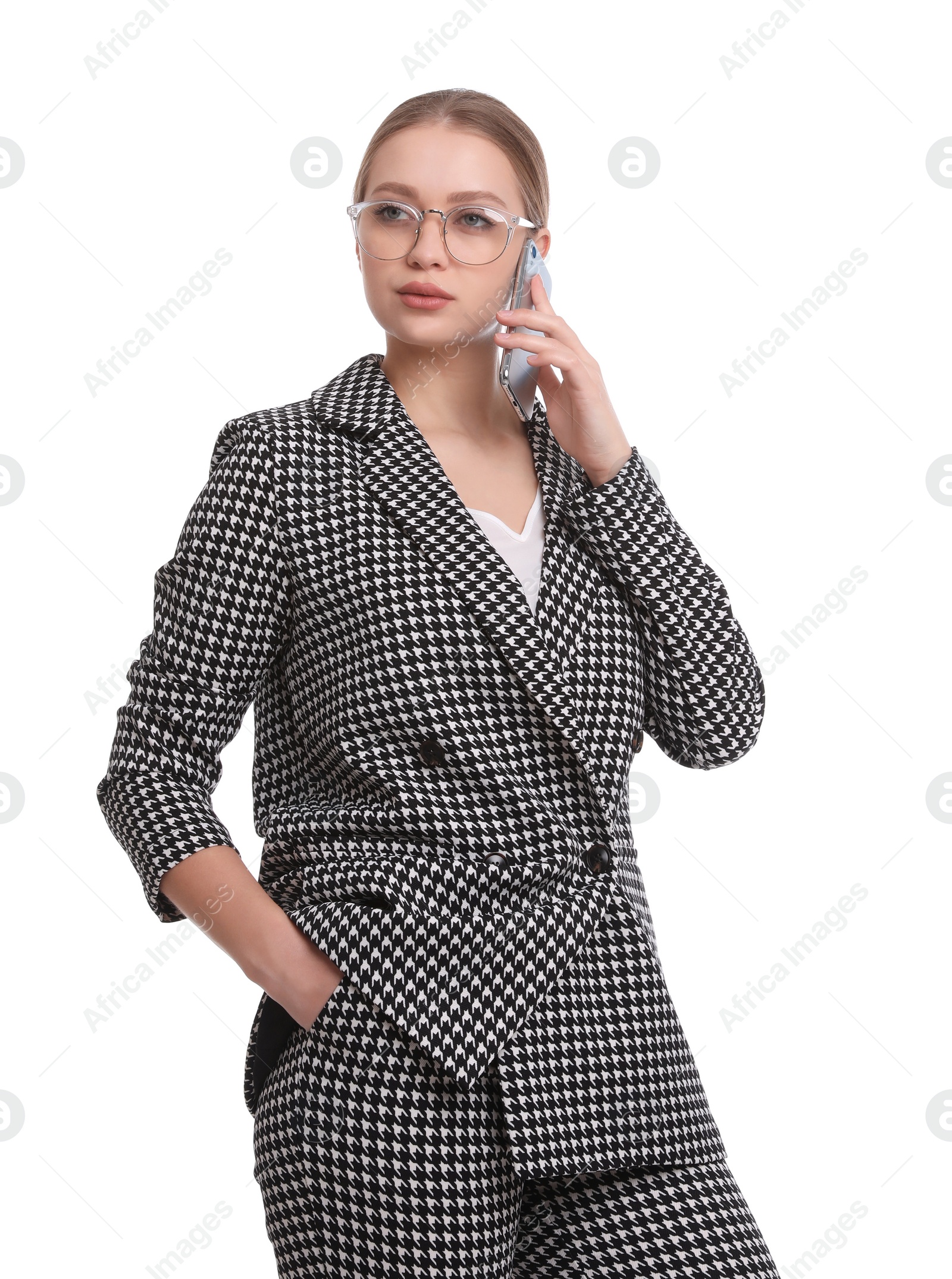 Photo of Young businesswoman talking on mobile phone against white background