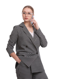 Young businesswoman talking on mobile phone against white background