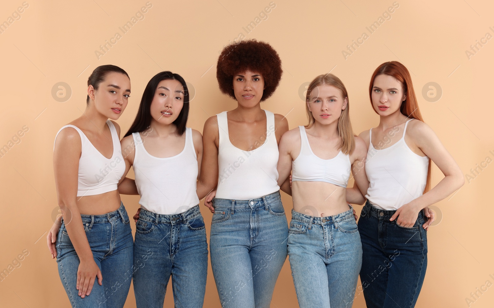 Photo of Group of beautiful young women on beige background