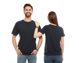 Photo of Young people in t-shirts on white background. Mock up for design