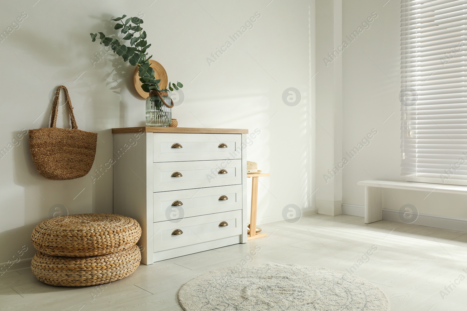 Photo of Chest of drawers in stylish room interior