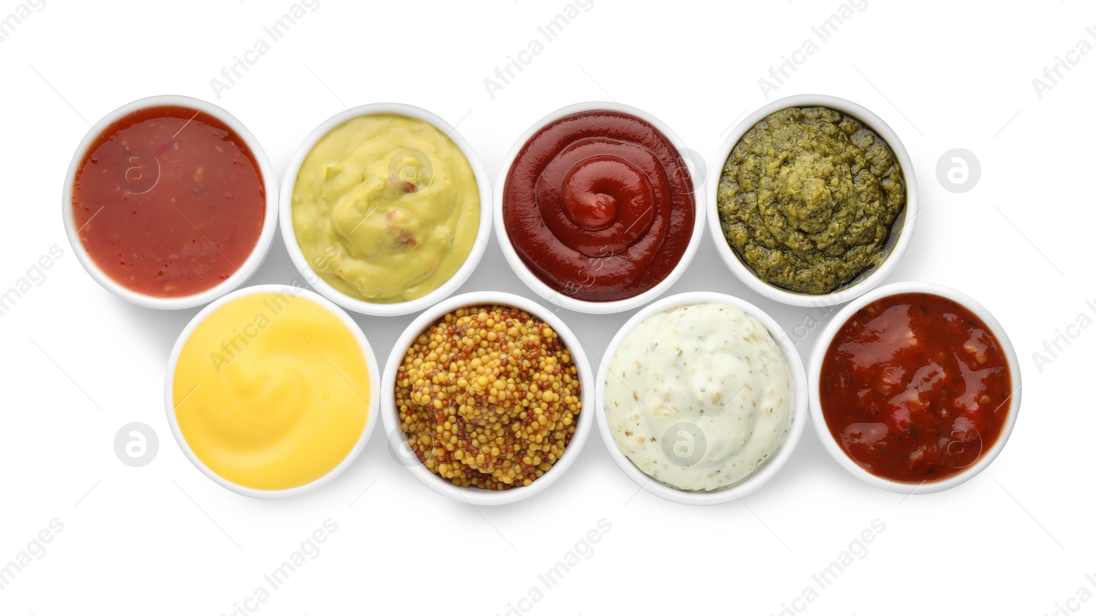 Photo of Many different sauces in bowls on white background, top view