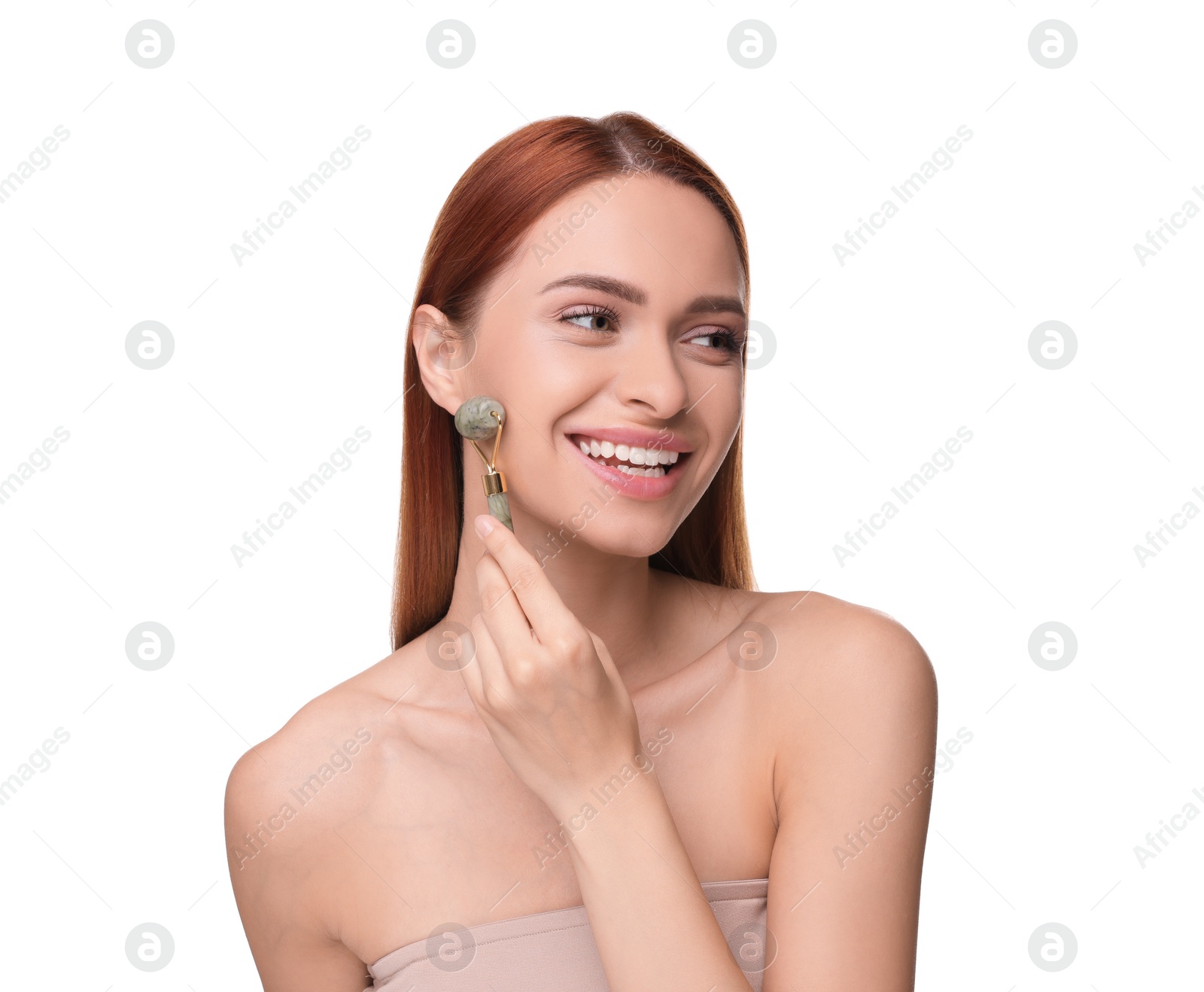 Photo of Young woman massaging her face with jade roller isolated on white