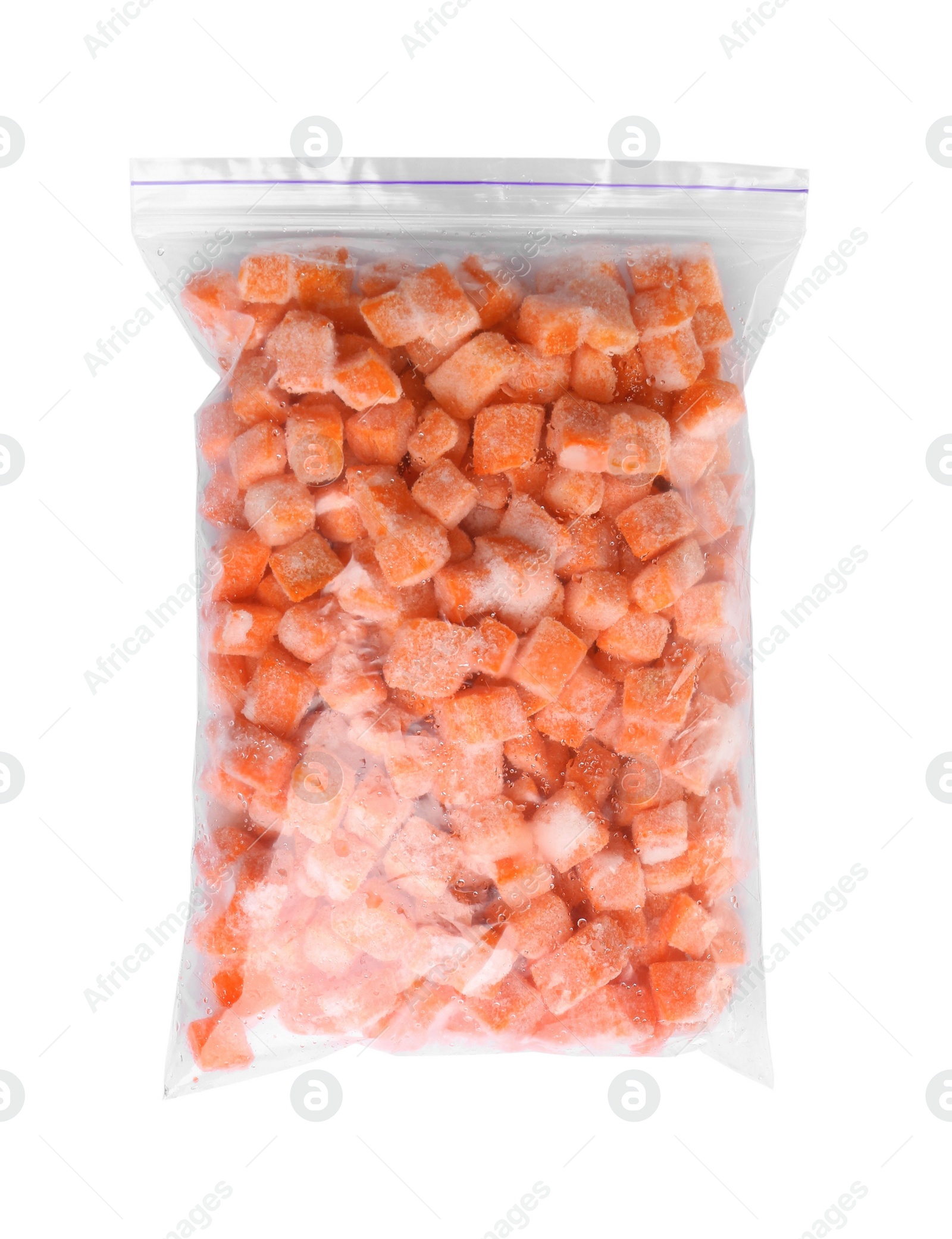 Photo of Frozen carrots in plastic bag isolated on white, top view. Vegetable preservation