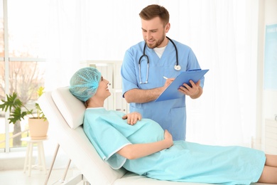 Gynecology consultation. Pregnant woman with her doctor in clinic