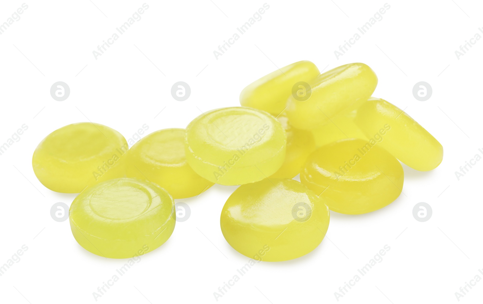 Photo of Many yellow cough drops on white background